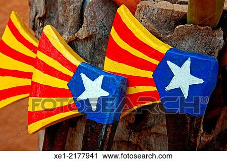 Stock Image - Wooden axes, toys, Catalan flag. Fotosearch