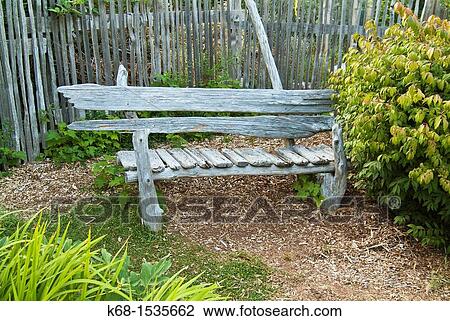 Wooden bench in a garden on Hornby Island, BC, Canada View Large Photo Image Stock Image - Wooden bench in a garden on Hornby Island, BC, Canada. Fotosearch