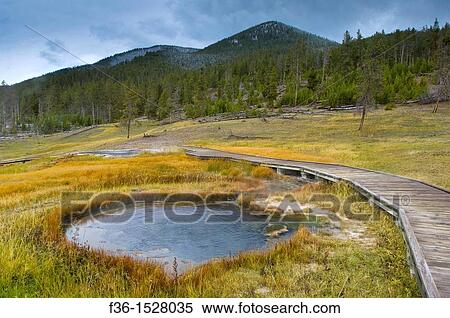Wooden boardwalk next to geothermal hot spring near Madison, Yellowstone National Park, Wyoming View Large Photo Image Stock Photography - Wooden boardwalk next to geothermal hot spring near Madison, Yellowstone National Park, Wyoming. Fotosearch