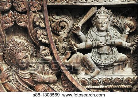Stock Photo - Wooden carving of the God at Vishnu temple, Hanuman Dhoka complex, world heritage monument zone, Durbar Square, Kathmandu, Nepal.. Fotosearch