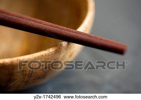 Wooden chopsticks and bowl View Large Photo Image Stock Photograph - Wooden chopsticks and bowl. Fotosearch