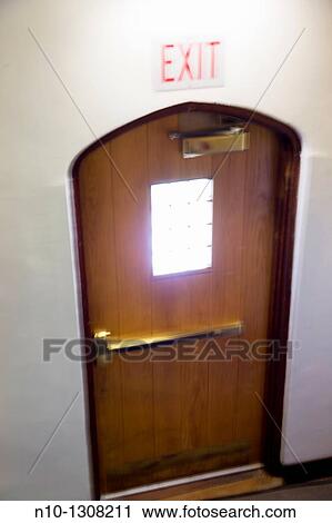 Wooden door with an? exit? sign above it View Large Photo Image Stock Image - Wooden door with an? exit? sign above it. Fotosearch
