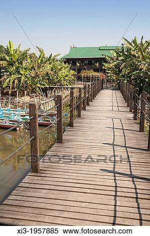 Wooden path leading to the Inthar Heritage House, Inpawkhon Village, Inle Lake, Shan State, Myanmar, (Burma). View Large Photo Image Stock Photography - Wooden path leading to the Inthar Heritage House, Inpawkhon Village, Inle Lake, Shan State, Myanmar, (Burma).. Fotosearch