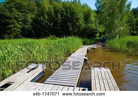 Wooden pier along Porvoonjoki river Porvoo Uusimaa province Finland northern Europe View Large Photo Image Stock Image - Wooden pier along Porvoonjoki river Porvoo Uusimaa province Finland northern Europe. Fotosearch
