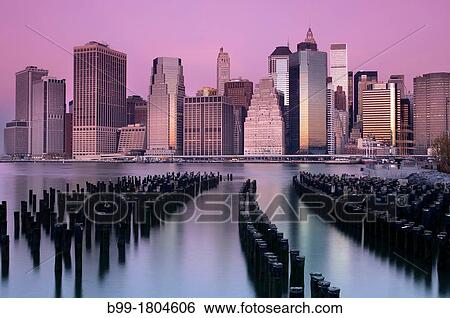 WOODEN PILINGS DOWNTOWN SKYLINE EAST RIVER MANHATTAN NEW YORK CITY USA View Large Photo Image Stock Photograph - WOODEN PILINGS DOWNTOWN SKYLINE EAST RIVER MANHATTAN NEW YORK CITY USA. Fotosearch