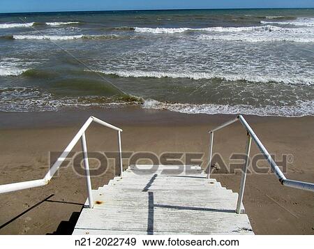 Stock Photo - Wooden stairs to the beach. Sitges, Garraf, Barcelona, Catalonia, Spain, Europe. Fotosearch