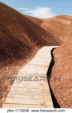 Wooden walkway through the Painted Hills John Day Fossil Bed National Monument in Or View Large Photo Image Stock Photograph - Wooden walkway through the Painted Hills John Day Fossil Bed National Monument in Or. Fotosearch