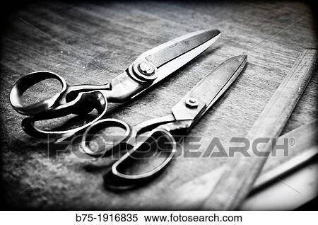 work table with scissors and tailor rules View Large Photo Image Stock Photography - work table with scissors and tailor rules. Fotosearch