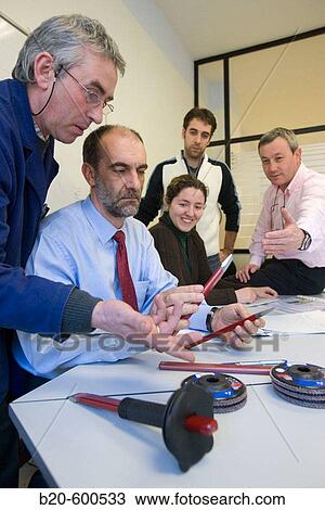 Work team meeting. Watching chisels. Manual tool. View Large Photo Image Stock Image - Work team meeting. Watching chisels. Manual tool.. Fotosearch