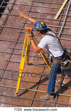 Worker at surveyor transit View Large Photo Image Stock Photography - Worker at surveyor transit. Fotosearch