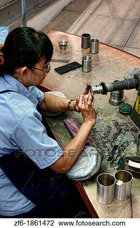 Worker finishing product design in Pewter Factory called Royal Selangor in Kuala Lumpur Malaysia Asia View Large Photo Image Stock Image - Worker finishing product design in Pewter Factory called Royal Selangor in Kuala Lumpur Malaysia Asia. Fotosearch