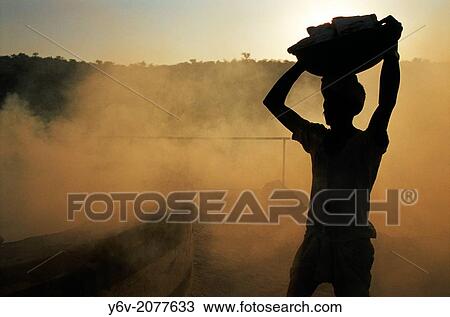 Stock Image - Worker in a gypsum kiln. Rajasthan, India.. Fotosearch