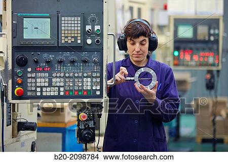 Worker measuring with caliper. Area automated CNC lathes. Machined Indecober. Machining of precision parts in series. Automotive industry. Berriz. Bizkaia. Basque Country. Spain. View Large Photo Image Picture - Worker measuring with caliper. Area automated CNC lathes. Machined Indecober. Machining of precision parts in series. Automotive industry. Berriz. Bizkaia. Basque Country. Spain.. Fotosearch