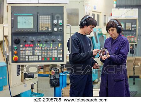 Worker measuring with caliper. Area automated CNC lathes. Machined Indecober. Machining of precision parts in series. Automotive industry. Berriz. Bizkaia. Basque Country. Spain. View Large Photo Image Stock Photography - Worker measuring with caliper. Area automated CNC lathes. Machined Indecober. Machining of precision parts in series. Automotive industry. Berriz. Bizkaia. Basque Country. Spain.. Fotosearch