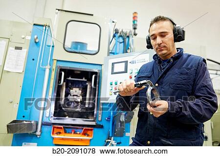 Worker measuring with caliper. Locking nut. Transfer machining. Machined Indecober. Machining of precision parts in series. Automotive industry. Berriz. Bizkaia. Basque Country. Spain. View Large Photo Image Stock Photo - Worker measuring with caliper. Locking nut. Transfer machining. Machined Indecober. Machining of precision parts in series. Automotive industry. Berriz. Bizkaia. Basque Country. Spain.. Fotosearch