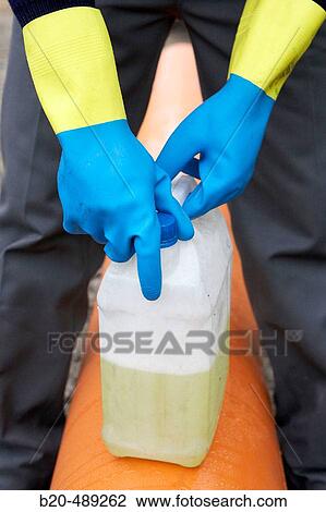 Worker opening barrel with protective gloves. View Large Photo Image Stock Image - Worker opening barrel with protective gloves.. Fotosearch