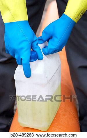 Worker opening barrel with protective gloves. View Large Photo Image Stock Image - Worker opening barrel with protective gloves.. Fotosearch