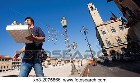 Worker placing The Luminaria of Sant Ranieri, is now a historic event that happens every year, with approximately 70, 000 lighting candles, placed in as many glasses, Palazzo Pretorio, Palace Pretorino, Arno River, Pisa, Italy, Europe. View Large Photo Image Stock Photograph - Worker placing The Luminaria of Sant Ranieri, is now a historic event that happens every year, with approximately 70, 000 lighting candles, placed in as many glasses, Palazzo Pretorio, Palace Pretorino, Arno River, Pisa, Italy, Europe.. Fotosearch