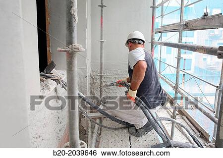 Worker projecting cement facade. Projection mortar. Building construction. Donostia. San Sebastian. Gipuzkoa. Basque Country. Spain. View Large Photo Image Stock Photograph - Worker projecting cement facade. Projection mortar. Building construction. Donostia. San Sebastian. Gipuzkoa. Basque Country. Spain.. Fotosearch