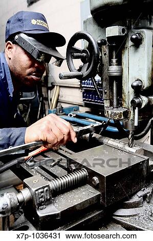 Worker taking measurements on drill press View Large Photo Image Stock Image - Worker taking measurements on drill press. Fotosearch