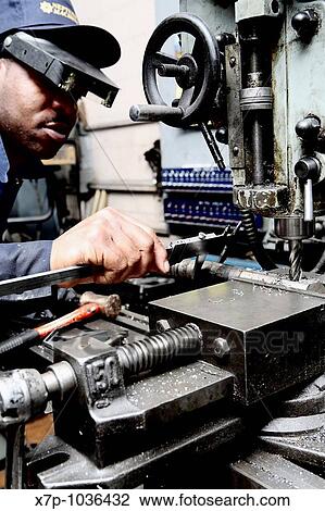 Worker taking measurements on drill press View Large Photo Image Stock Image - Worker taking measurements on drill press. Fotosearch