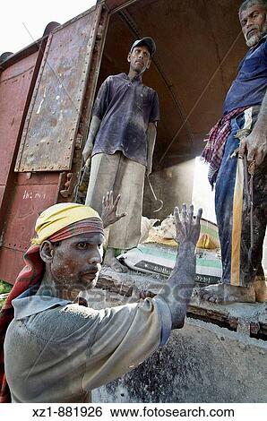 Worker unloading cement bags from train, from Jessore to Dhaka, Bangladesh View Large Photo Image Stock Photograph - Worker unloading cement bags from train, from Jessore to Dhaka, Bangladesh. Fotosearch