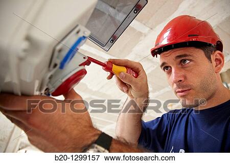 Worker using screwdriver in construction site, fuse box View Large Photo Image Stock Photo - Worker using screwdriver in construction site, fuse box. Fotosearch