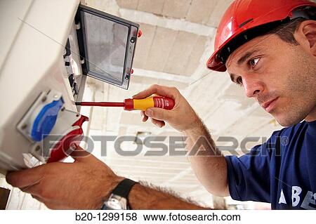 Worker using screwdriver in construction site, fuse box View Large Photo Image Stock Photo - Worker using screwdriver in construction site, fuse box. Fotosearch