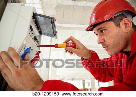 Worker using screwdriver in construction site, fuse box View Large Photo Image Stock Photo - Worker using screwdriver in construction site, fuse box. Fotosearch