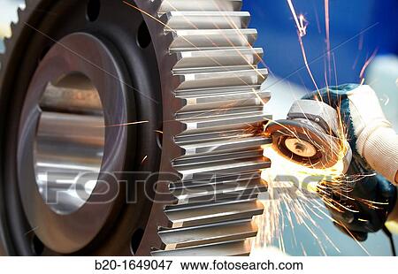 Worker with grinder finish by piece, production of steel gears, cogwheel, mechanical industry, gearbox mill, Gipuzkoa, Basque Country, Spain View Large Photo Image Stock Photo - Worker with grinder finish by piece, production of steel gears, cogwheel, mechanical industry, gearbox mill, Gipuzkoa, Basque Country, Spain. Fotosearch