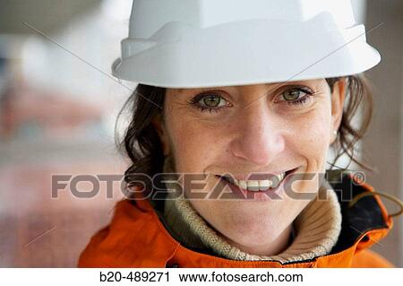 Worker with helmet. Housing construction, apartments. San Sebastian, Gipuzkoa, Euskadi. Spain. View Large Photo Image Stock Image - Worker with helmet. Housing construction, apartments. San Sebastian, Gipuzkoa, Euskadi. Spain.. Fotosearch