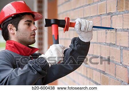 Worker with mallet and chisel, building construction. View Large Photo Image Stock Photo - Worker with mallet and chisel, building construction.. Fotosearch