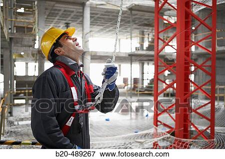 Worker with protective equipment and safety harness. San Sebastian, Gipuzkoa, Euskadi. Spain. View Large Photo Image Stock Photo - Worker with protective equipment and safety harness. San Sebastian, Gipuzkoa, Euskadi. Spain.. Fotosearch
