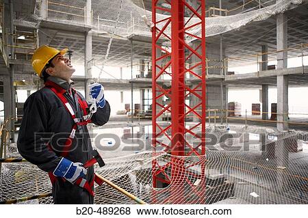 Worker with protective equipment and safety harness. San Sebastian, Gipuzkoa, Euskadi. Spain. View Large Photo Image Stock Photo - Worker with protective equipment and safety harness. San Sebastian, Gipuzkoa, Euskadi. Spain.. Fotosearch