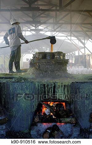 Worker with protective gear filling melted sulphur into a bucket at the sulphur kitchen that is close to the Kawah Ijen sulphur mine, Java, Indonesia, Southeast Asia View Large Photo Image Stock Photograph - Worker with protective gear filling melted sulphur into a bucket at the sulphur kitchen that is close to the Kawah Ijen sulphur mine, Java, Indonesia, Southeast Asia. Fotosearch