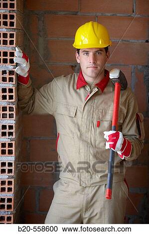 Worker with sledgehammer, housing construction. Guipuzcoa, Euskadi, Spain View Large Photo Image Stock Image - Worker with sledgehammer, housing construction. Guipuzcoa, Euskadi, Spain. Fotosearch
