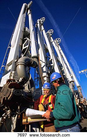 Workers at oil retrieving station. Valdez. Alaska. USA View Large Photo Image Stock Photo - Workers at oil retrieving station. Valdez. Alaska. USA. Fotosearch