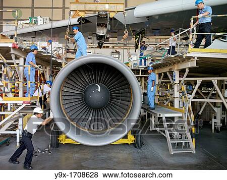 Workers in a maintenance aviation facility at the SIA Engineering Company in Singapore View Large Photo Image Stock Photo - Workers in a maintenance aviation facility at the SIA Engineering Company in Singapore. Fotosearch