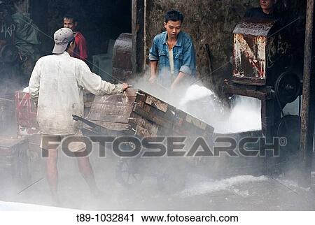 Workers in the fish Market, crashing ice. View Large Photo Image Stock Image - Workers in the fish Market, crashing ice.. Fotosearch