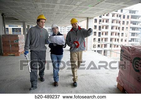 Workers with blueprints and tools. Housing construction, apartments. San Sebastian, Gipuzkoa, Euskadi. Spain. View Large Photo Image Stock Photo - Workers with blueprints and tools. Housing construction, apartments. San Sebastian, Gipuzkoa, Euskadi. Spain.. Fotosearch