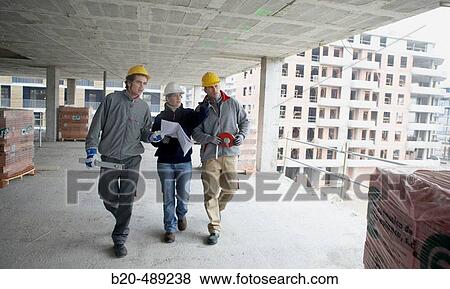 Workers with blueprints and tools. Housing construction, apartments. San Sebastian, Gipuzkoa, Euskadi. Spain. View Large Photo Image Stock Photo - Workers with blueprints and tools. Housing construction, apartments. San Sebastian, Gipuzkoa, Euskadi. Spain.. Fotosearch