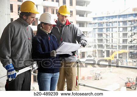 Workers with blueprints and tools. Housing construction, apartments. San Sebastian, Gipuzkoa, Euskadi. Spain. View Large Photo Image Stock Photo - Workers with blueprints and tools. Housing construction, apartments. San Sebastian, Gipuzkoa, Euskadi. Spain.. Fotosearch