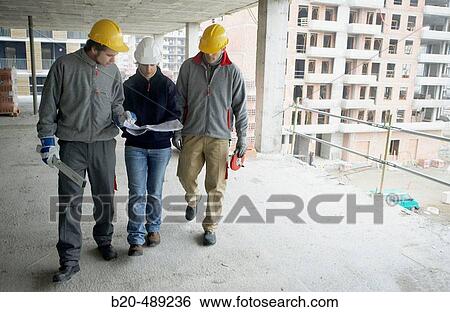 Workers with blueprints and tools. Housing construction, apartments. San Sebastian, Gipuzkoa, Euskadi. Spain. View Large Photo Image Stock Photograph - Workers with blueprints and tools. Housing construction, apartments. San Sebastian, Gipuzkoa, Euskadi. Spain.. Fotosearch