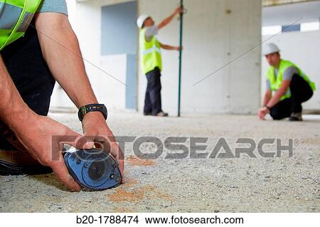 Workers with personal protective equipment, PPE, Marking guide lines for the construction of interior walls, Line tracer, housing construction, concrete, Basque Country, Spain View Large Photo Image Picture - Workers with personal protective equipment, PPE, Marking guide lines for the construction of interior walls, Line tracer, housing construction, concrete, Basque Country, Spain. Fotosearch