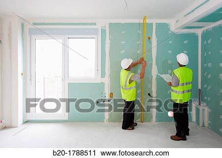Workers with protective equipment, PPE, Measuring plasterboard panels, housing construction, Retractable tape, Basque Country, Spain View Large Photo Image Stock Image - Workers with protective equipment, PPE, Measuring plasterboard panels, housing construction, Retractable tape, Basque Country, Spain. Fotosearch