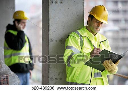 Workers with reflective clothes and safety equipment. Housing construction, apartments. San Sebastian, Gipuzkoa, Euskadi. Spain. View Large Photo Image Stock Photograph - Workers with reflective clothes and safety equipment. Housing construction, apartments. San Sebastian, Gipuzkoa, Euskadi. Spain.. Fotosearch