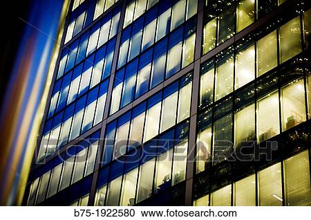 Working office building at night with lights on View Large Photo Image Stock Image - Working office building at night with lights on. Fotosearch