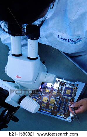 Working on a card for satellites used at the Thales Alenia Space Center at Toulouse, Haute-Garonne, Midi-Pyrenees, France View Large Photo Image Stock Image - Working on a card for satellites used at the Thales Alenia Space Center at Toulouse, Haute-Garonne, Midi-Pyrenees, France. Fotosearch