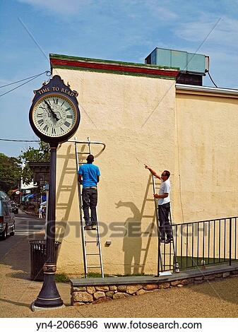 Workmen prepare to install a piece of art on an exterior wall in downtown Vineyard Haven, Martha's Vineyard, Massachussets. View Large Photo Image Stock Photograph - Workmen prepare to install a piece of art on an exterior wall in downtown Vineyard Haven, Martha's Vineyard, Massachussets.. Fotosearch