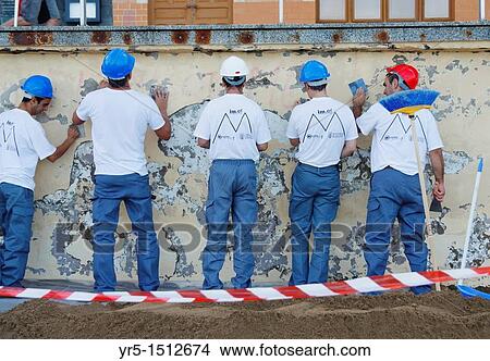 Picture - Workmen repairing sea wall on Las Canteras beach in Las Palmas, Gran Canaria, Canary Islands. Fotosearch
